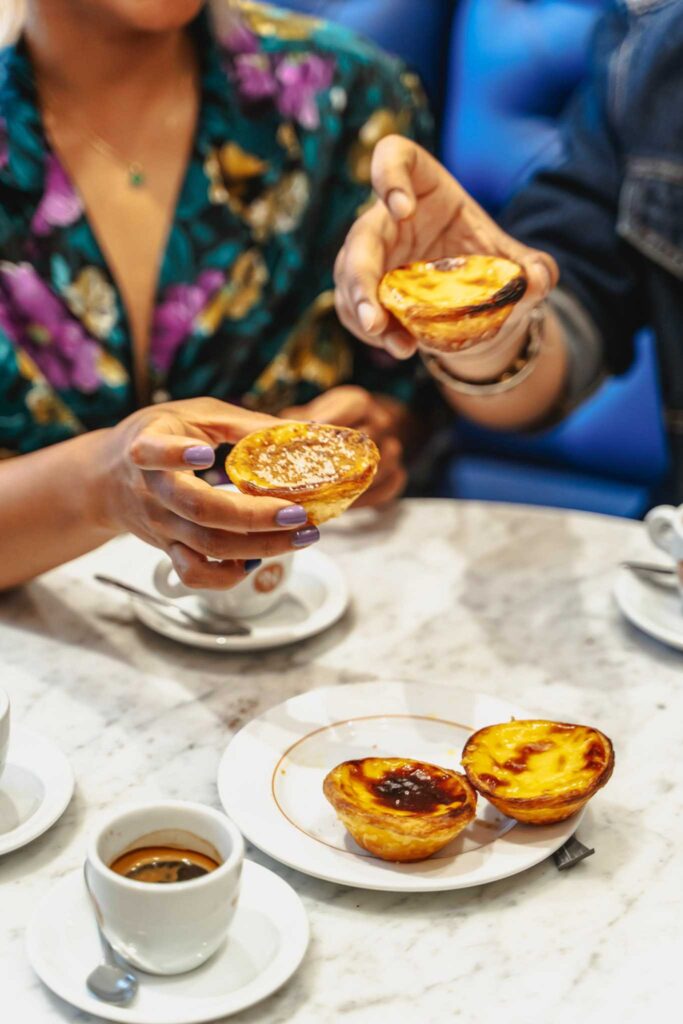 Holding Portugal's famous pastel de nata on our Lisbon Food Tour