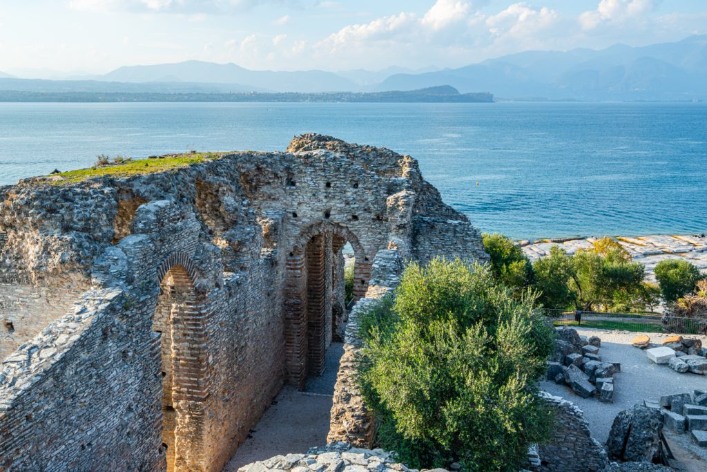 A portion of the Grotte di Catullo ruins with Lake Garda in the background, one of the best sights in Sirmione, Italy