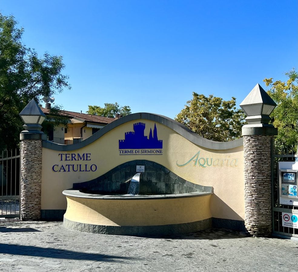 The front sign of Terme Catullo with a fountain in Sirmione on Lago di Garda