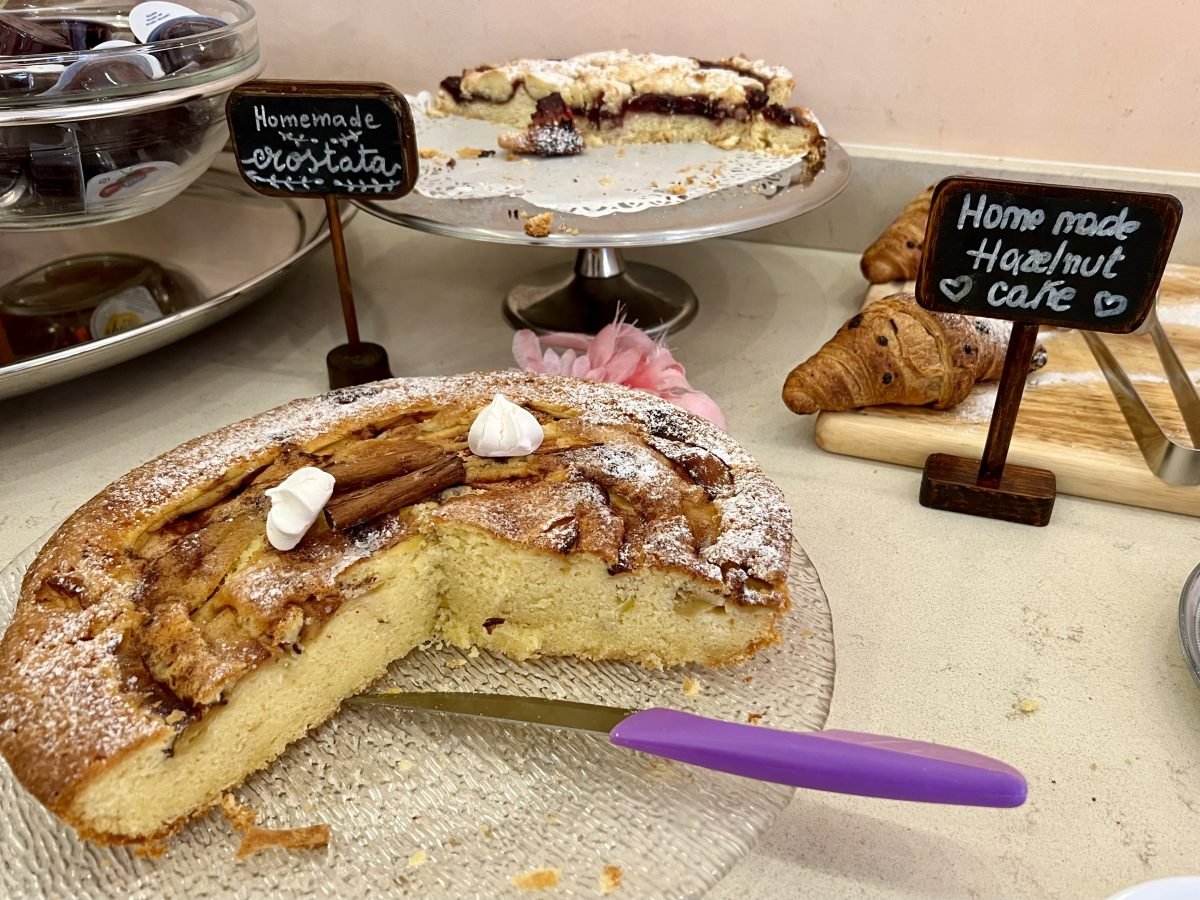 Cakes and crostata laid out for breakfast in Sirmione, Italy