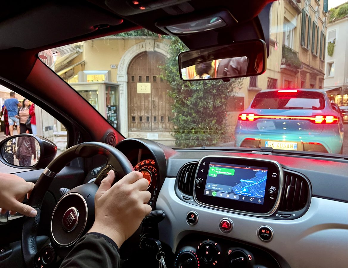 View from the driver's seat while navigating through Sirmione's historic center