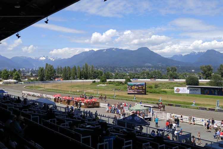 Hastings Park racecourse view of the track and North Shore mountains in East Vancouver