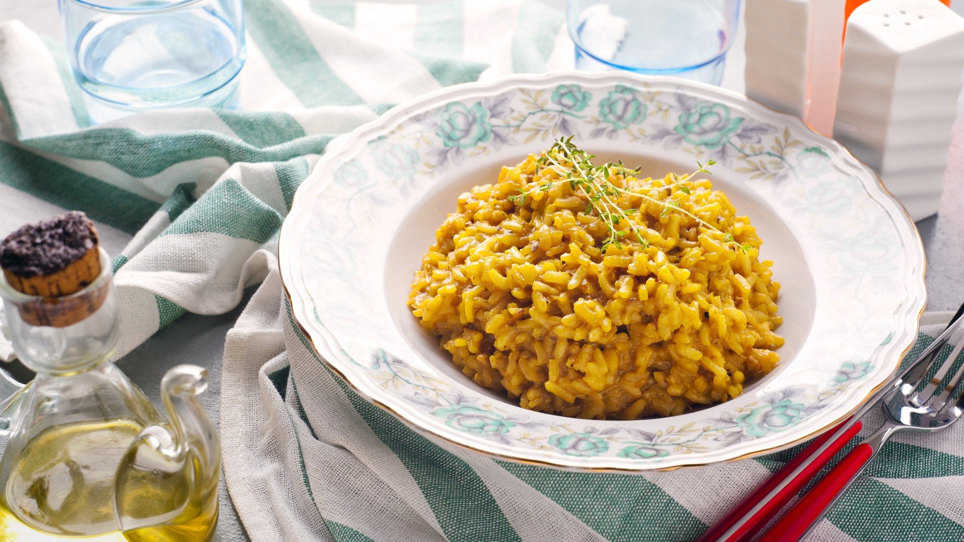 A dish of Risotto alla Milanese, a staple of Italian cuisine.