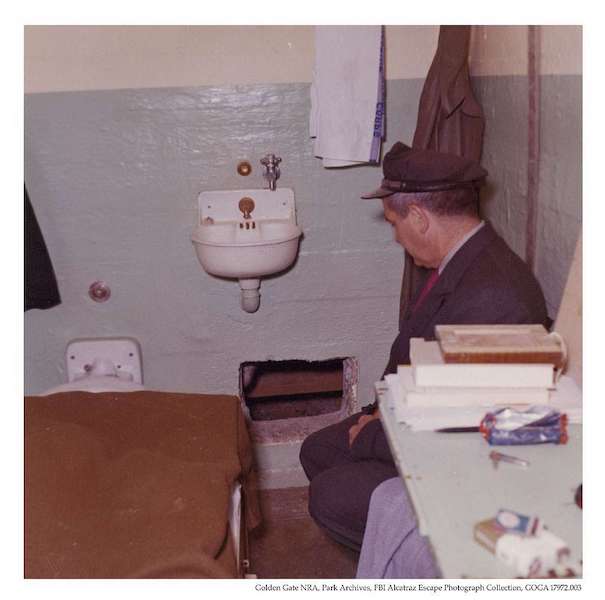 Alcatraz correctional officer in Frank Morris' cell post-1962 escape.