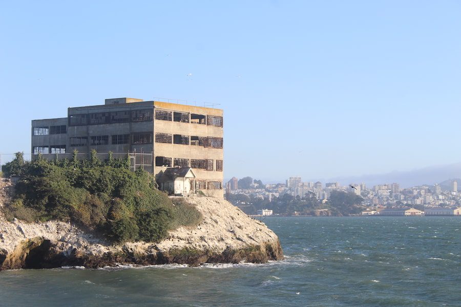 Juxtaposition between a derelict building on Alcatraz Island and the city of San Francisco.