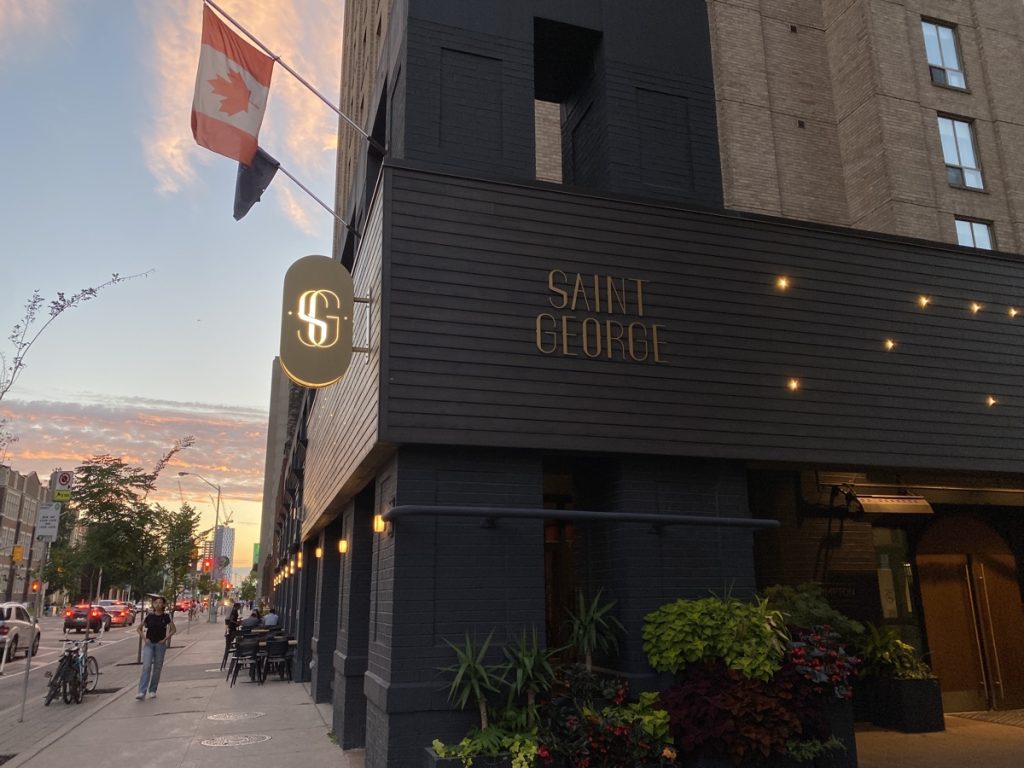 Exterior of the Kimpton Saint George Hotel in Toronto at sunset