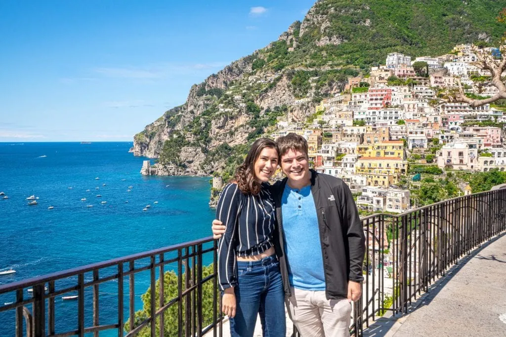 Kate Storm and Jeremy Storm on a balcony overlooking Positano