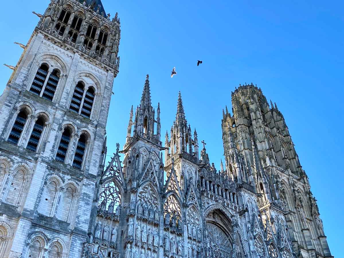 Rouen Cathedral showcasing the three towers of different architectural eras.