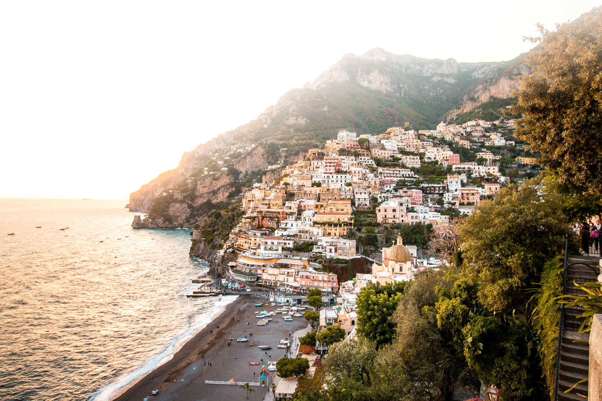 A panoramic view of Positano, with its buildings cascading steeply down toward the sea.