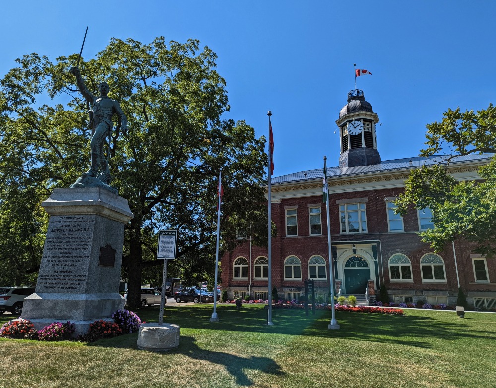 Port Hope Town Hall exterior with a memorial statue out front