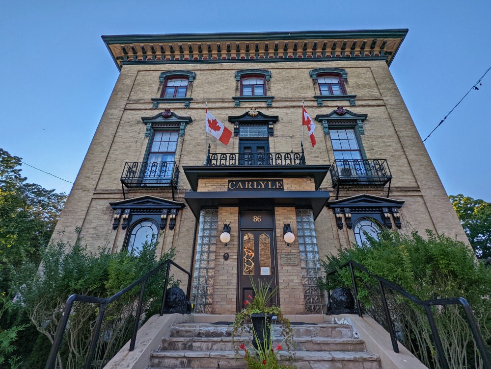 Hotel Carlyle exterior with steps leading up to the main door of the historic building