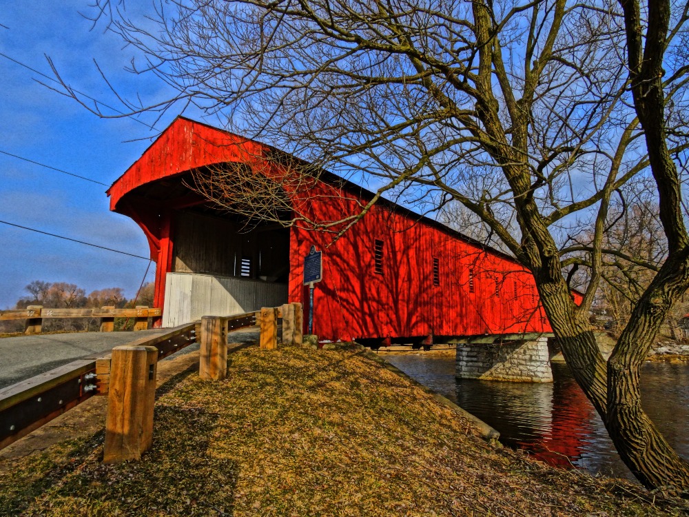 Historic red wooden bridge known as West Montrose Covered Bridge