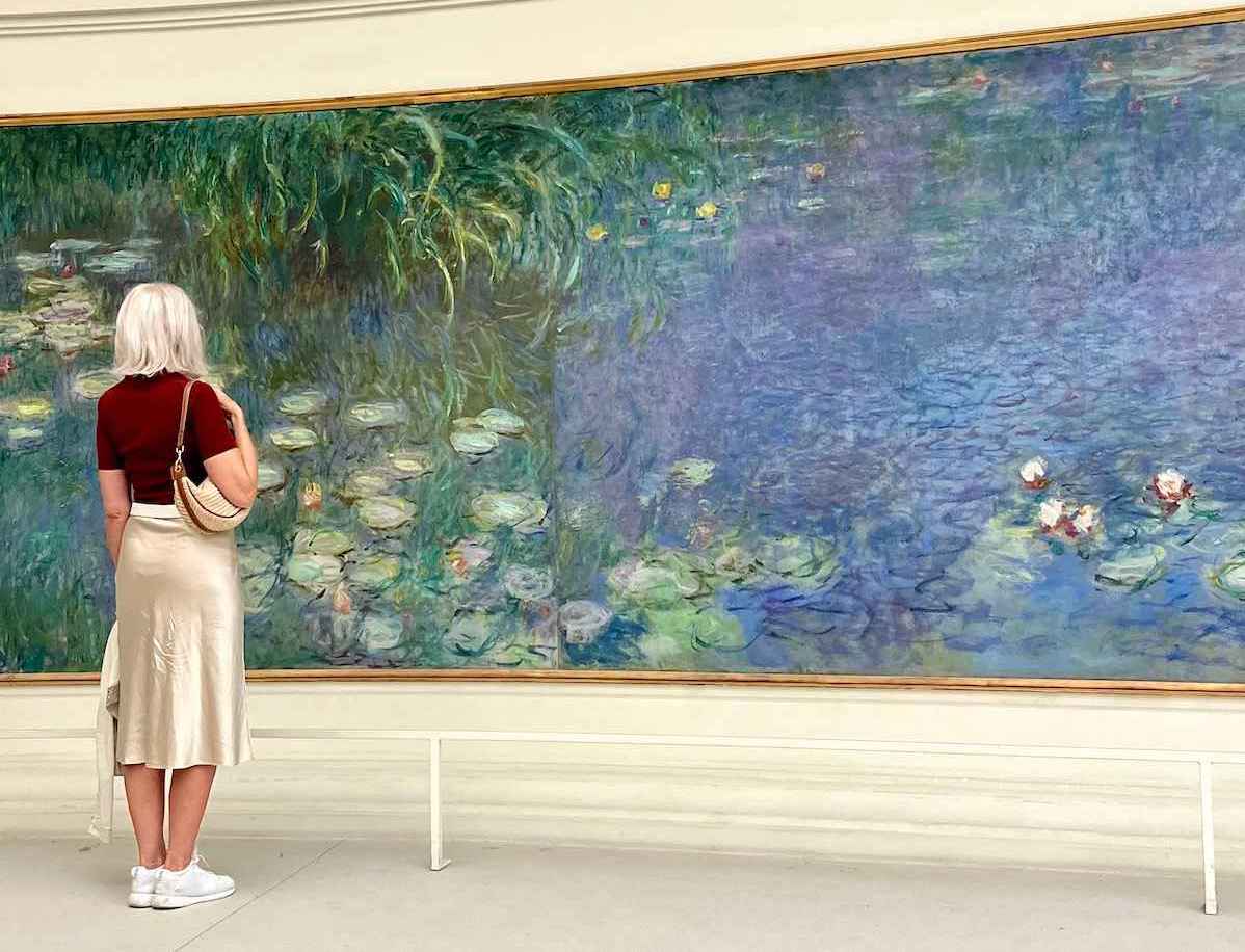 Carol Perehudoff admiring Monet's Water Lilies paintings at the Orangerie Museum.