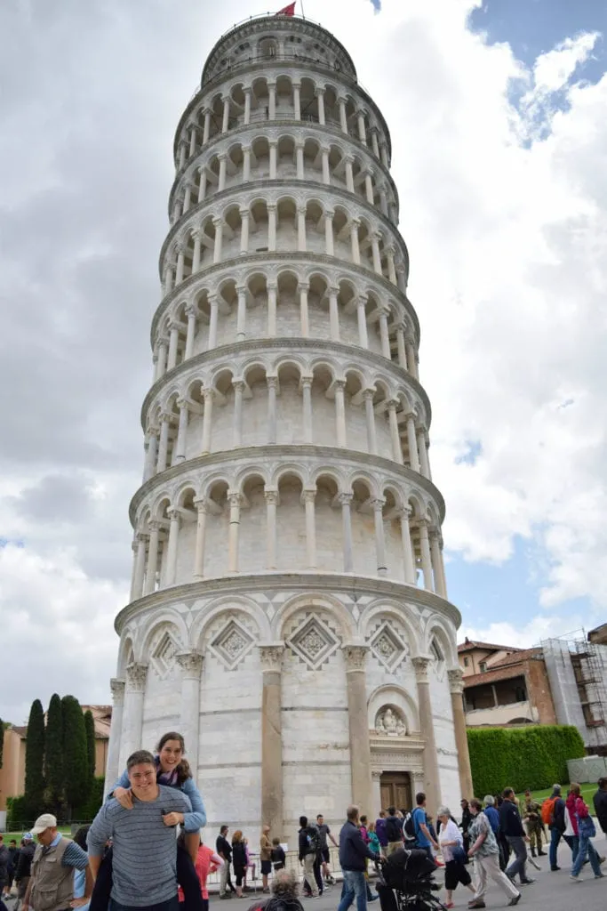 Kate Storm and Jeremy Storm at the Leaning Tower of Pisa--a bucket list destination for travelers!