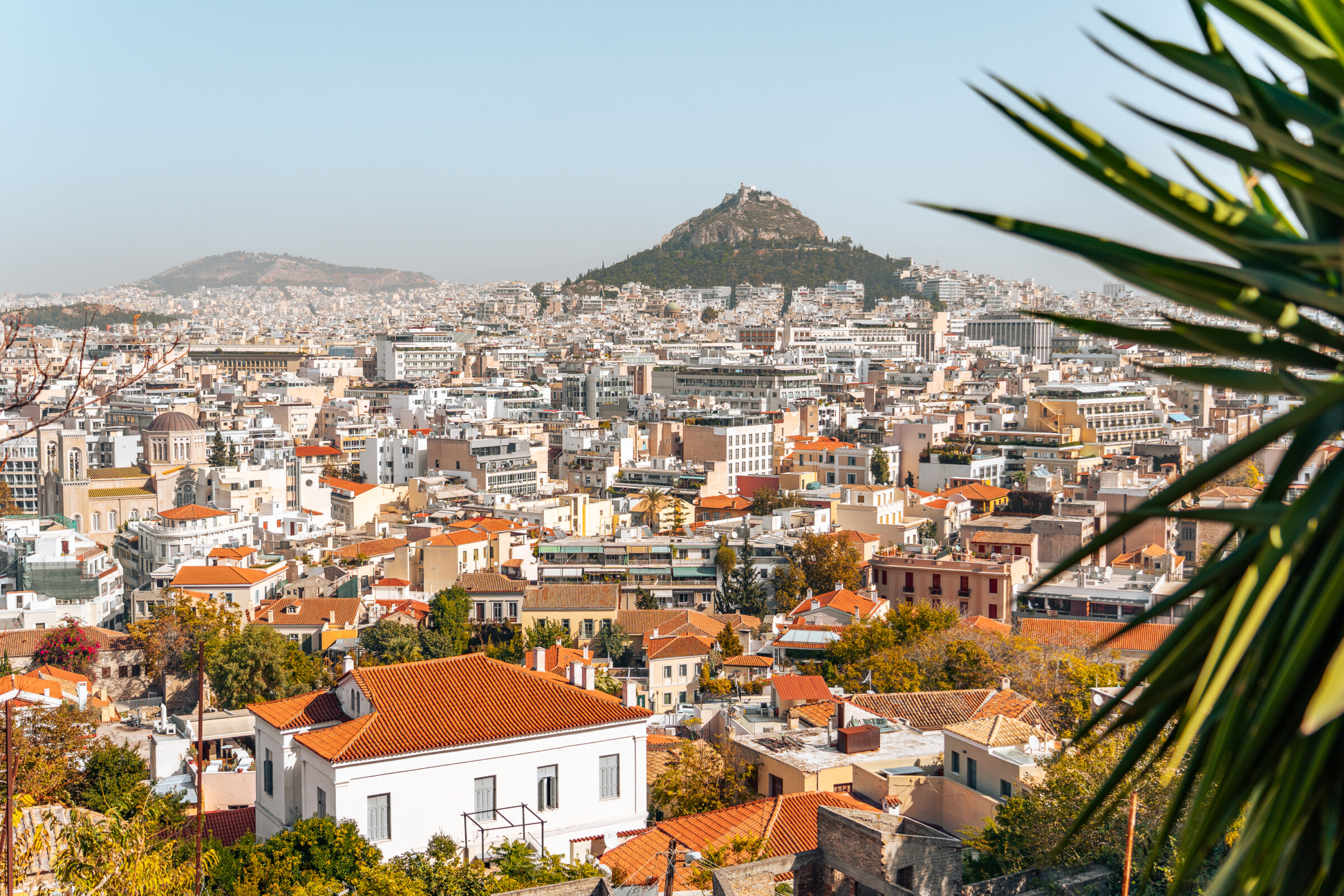 A panoramic view of Athens with Lycabettus Hill in the background.