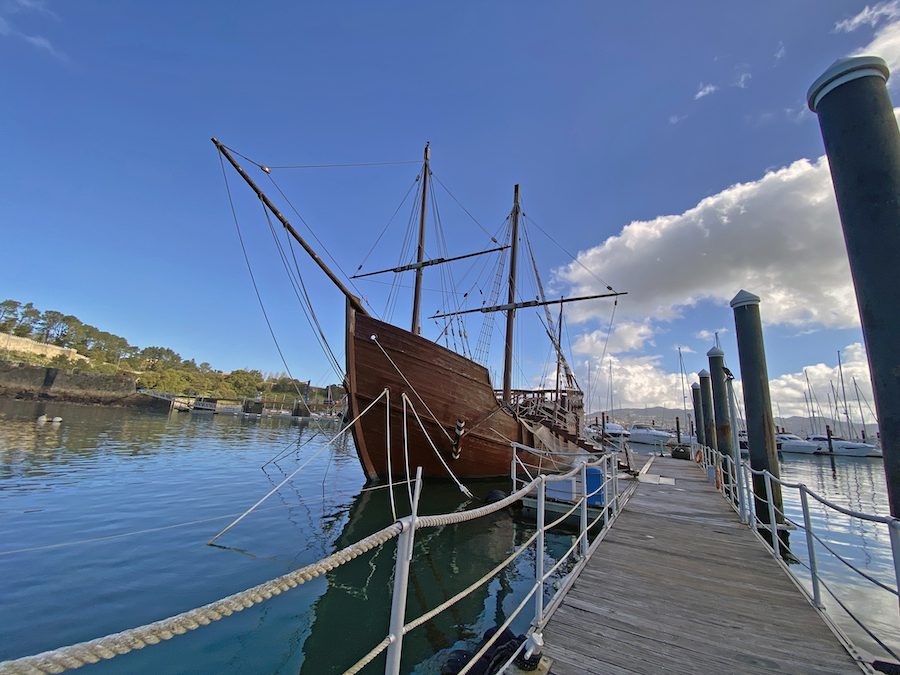 A model of La Pinta, the first of Columbus' ships to return to Spain, sits in the harbour in Baiona.