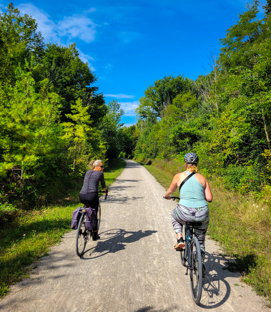 Kat and Vicky from Changing Gears Adventures cycling G2G Rail trail, photo by Paul McGrath