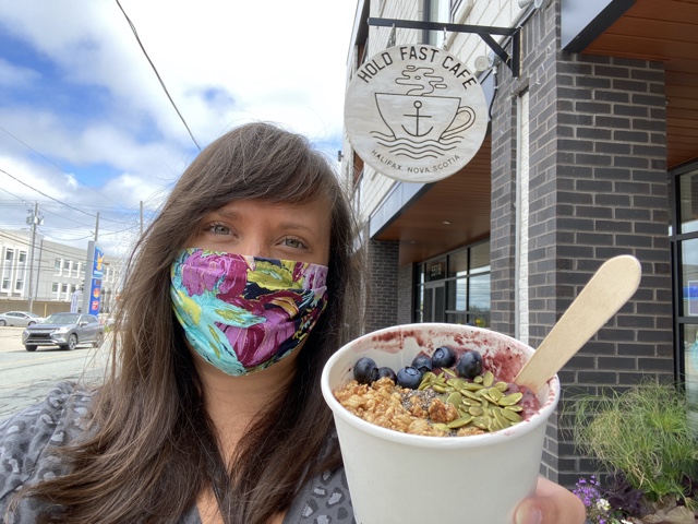 Cailin wearing a mask with an acai bowl in Halifax