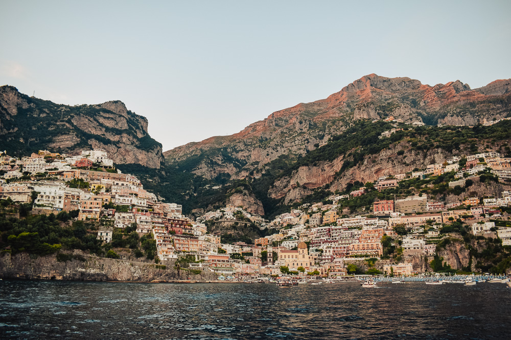 Positano at sunset as seen from the sea during our private boat trip