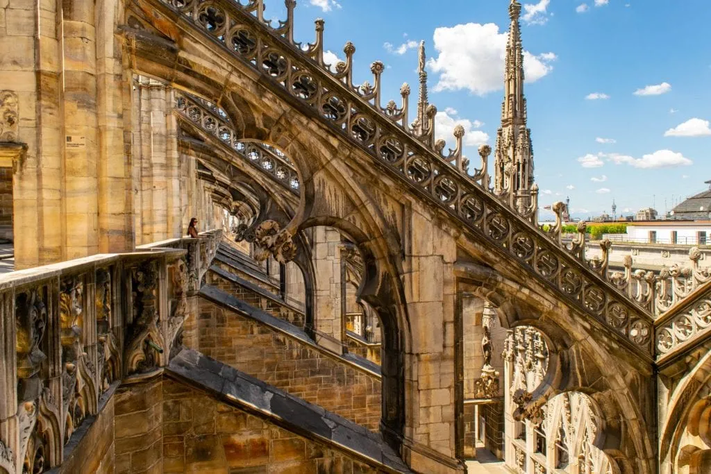 kate storm looking out over the duomo di milano rooftop terraces, one of the best places to visit in piazza del duomo milan italy