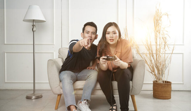 A couple playing video games together