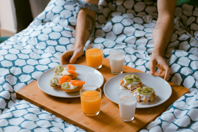 Romantic idea for hotel room: having breakfast in bed