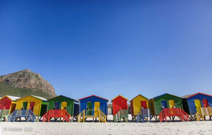 row of colorful beach houses at Muizenberg Beach