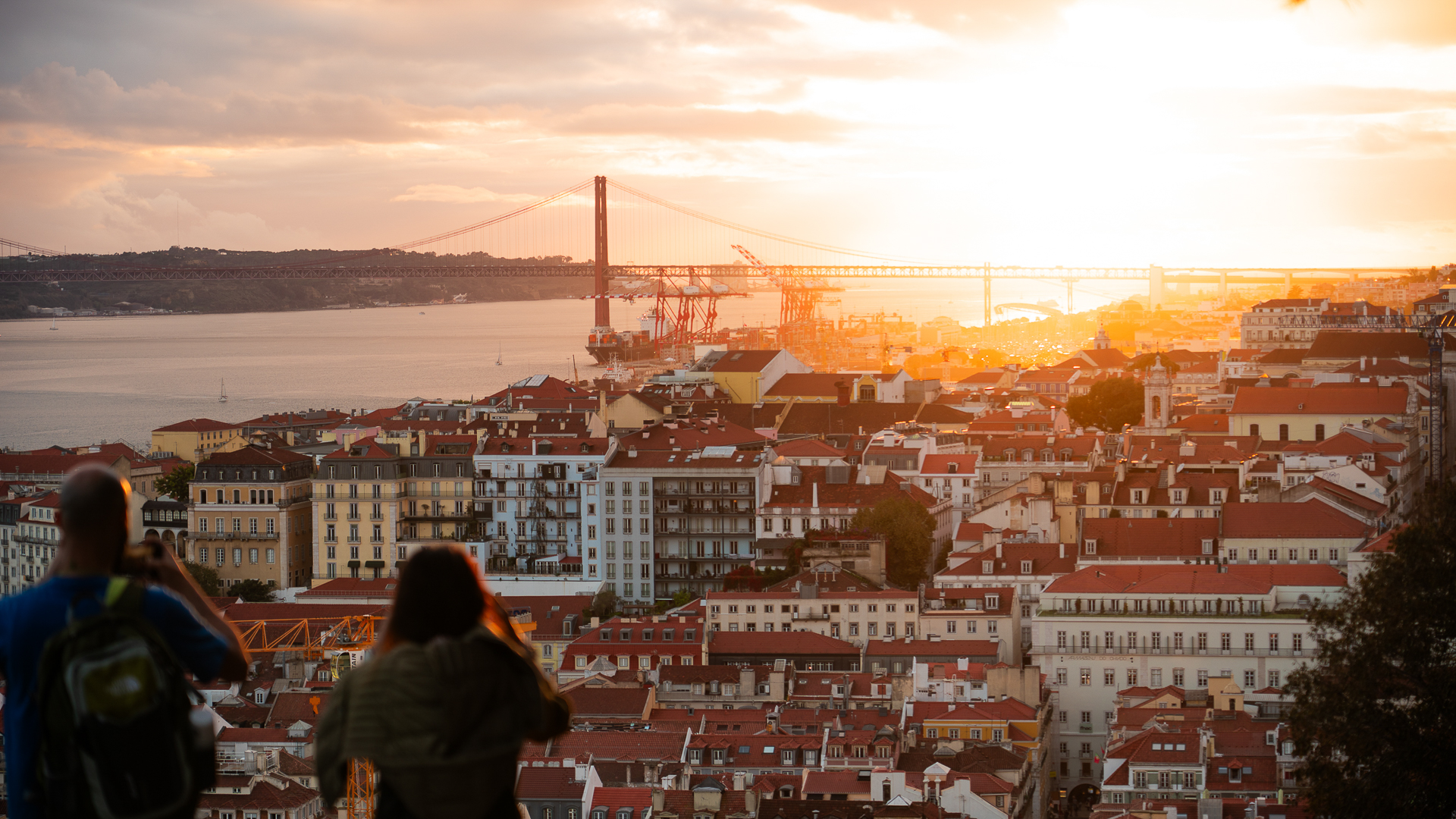 This image shows a panoramic view of Lisbon at sunset.