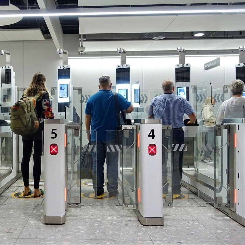 Travelers Scanning Their Passports At eGates For Automated Border Control, International Travel