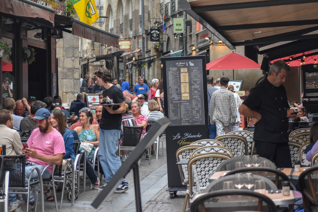 French citizens dining and enjoying drinks, late August 2024, downtown Nantes