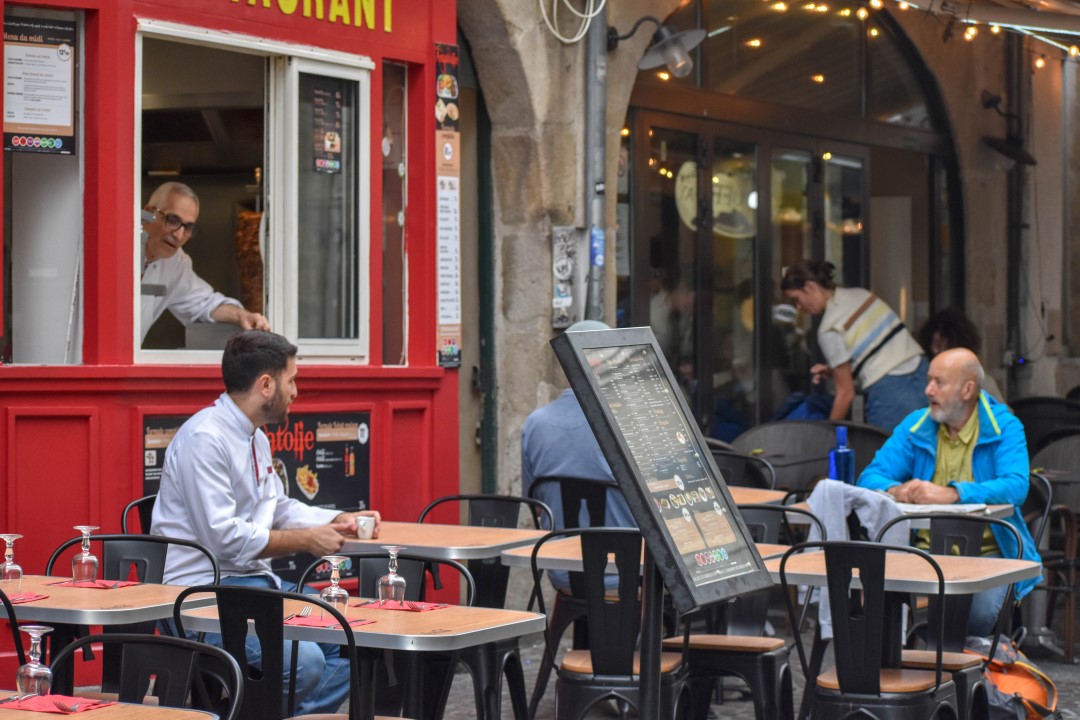 French citizens dining and enjoying drinks, late August 2024, downtown Nantes