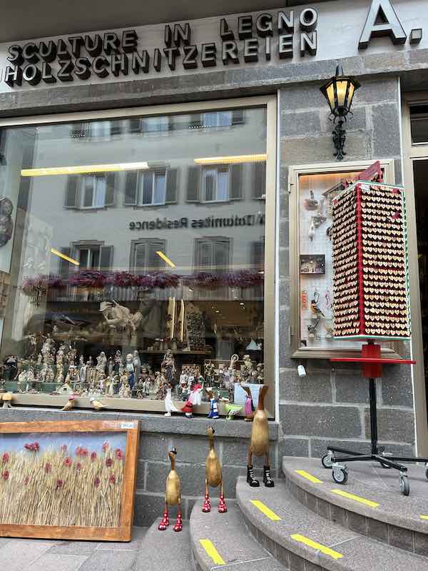 Wooden souvenirs available in a shop located in Ortisei