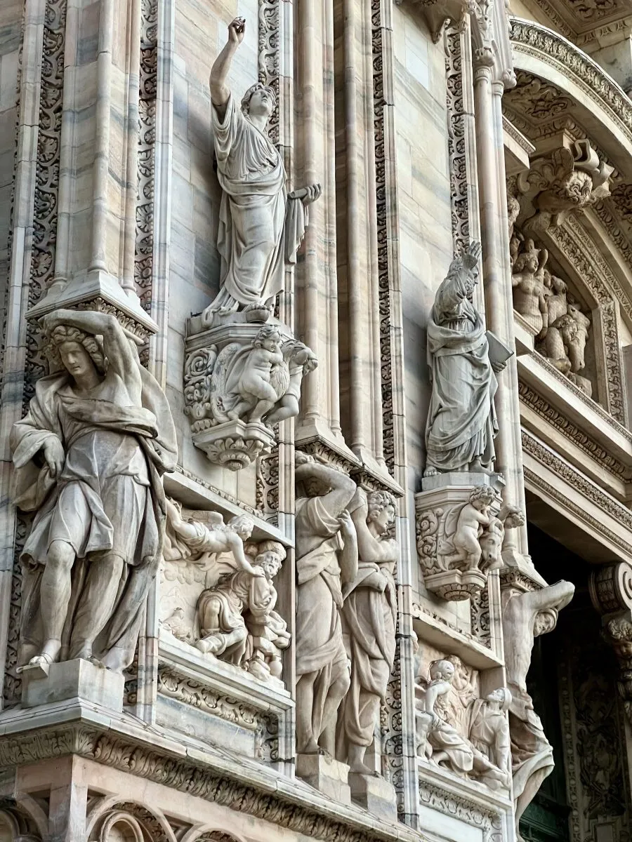 Detailed carvings on the facade of the Milan Cathedral