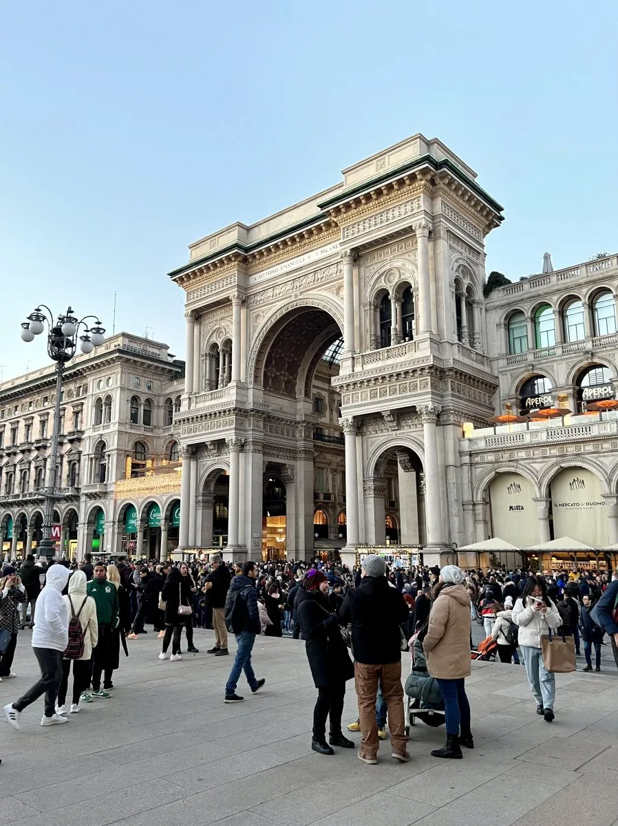 Entrance of Galleria Vittorio Emanuele II during a busy evening