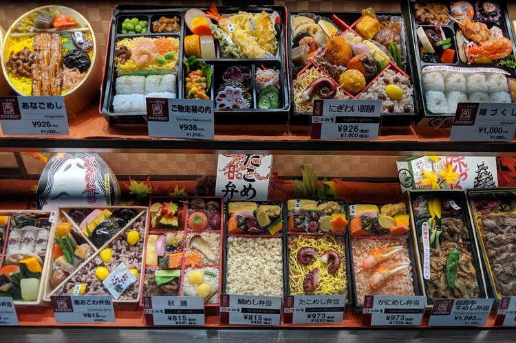 Japan travel tips - food display bento box and sushi to-go at train station