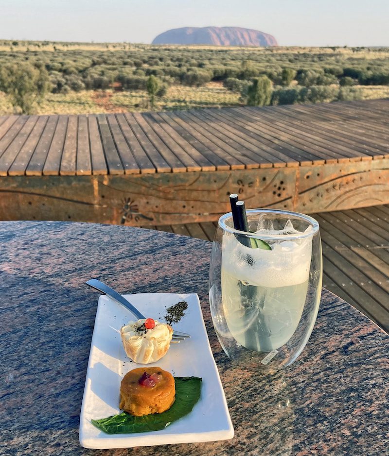 Appetizer of cauliflower tart with wattleseeds and sweet potato flan, accompanied by a cucumber cooler made with local gin.