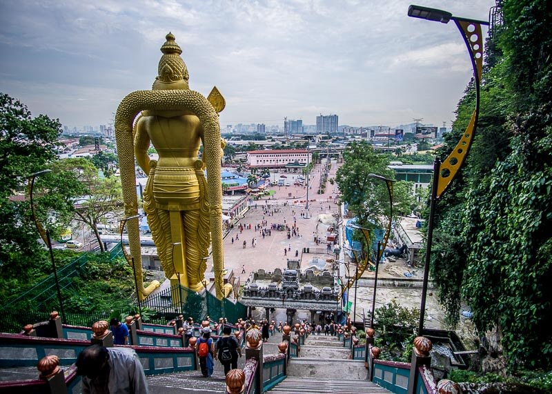 Climbing Batu Caves Steps to See the Famous Temple Cave | Kuala Lumpur has been on my bucket list for over a decade. The street food is incredible, along with the twin towers and the Batu caves. Click to read more and see the photography about the Batu Caves #nomad #batucaves #wanderlust #malaysia #slowtravel