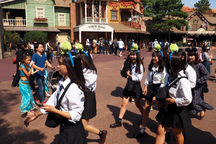 Japanese girls dressed in similar Disney themed costumes at Tokyo Disney Resort