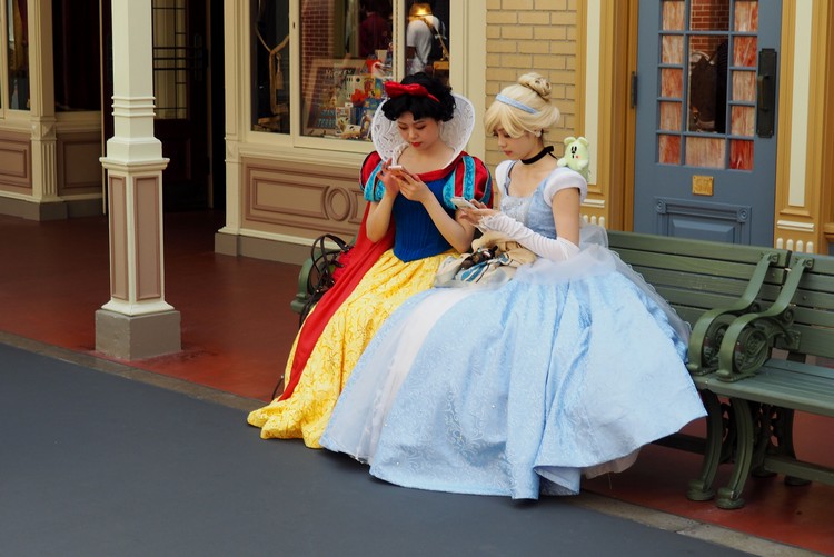 Girls dressed as Cinderella and Snow White at Tokyo Disneyland Japan