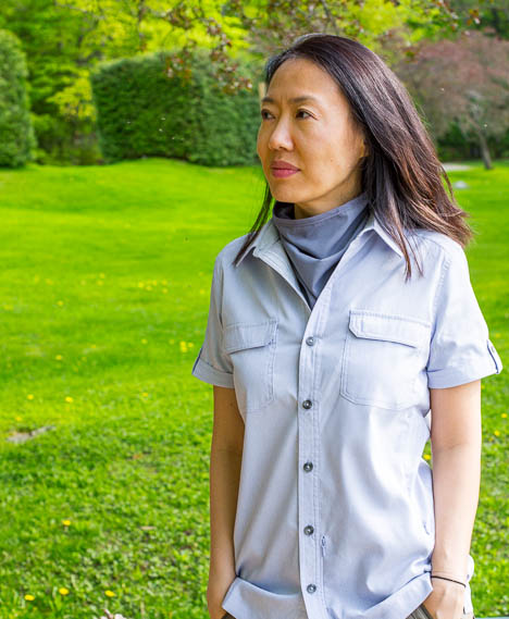 Asian woman wearing Mark’s WindRiver mosquito repellent clothes.