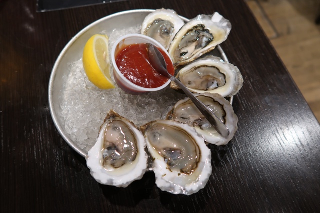 Half a dozen buck-a-shuck PEI oysters at The Olde Dublin Pub Happy Hour