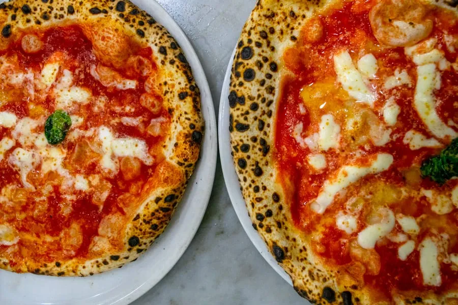 Two pizzas from Pizzeria da Michele, as seen from above