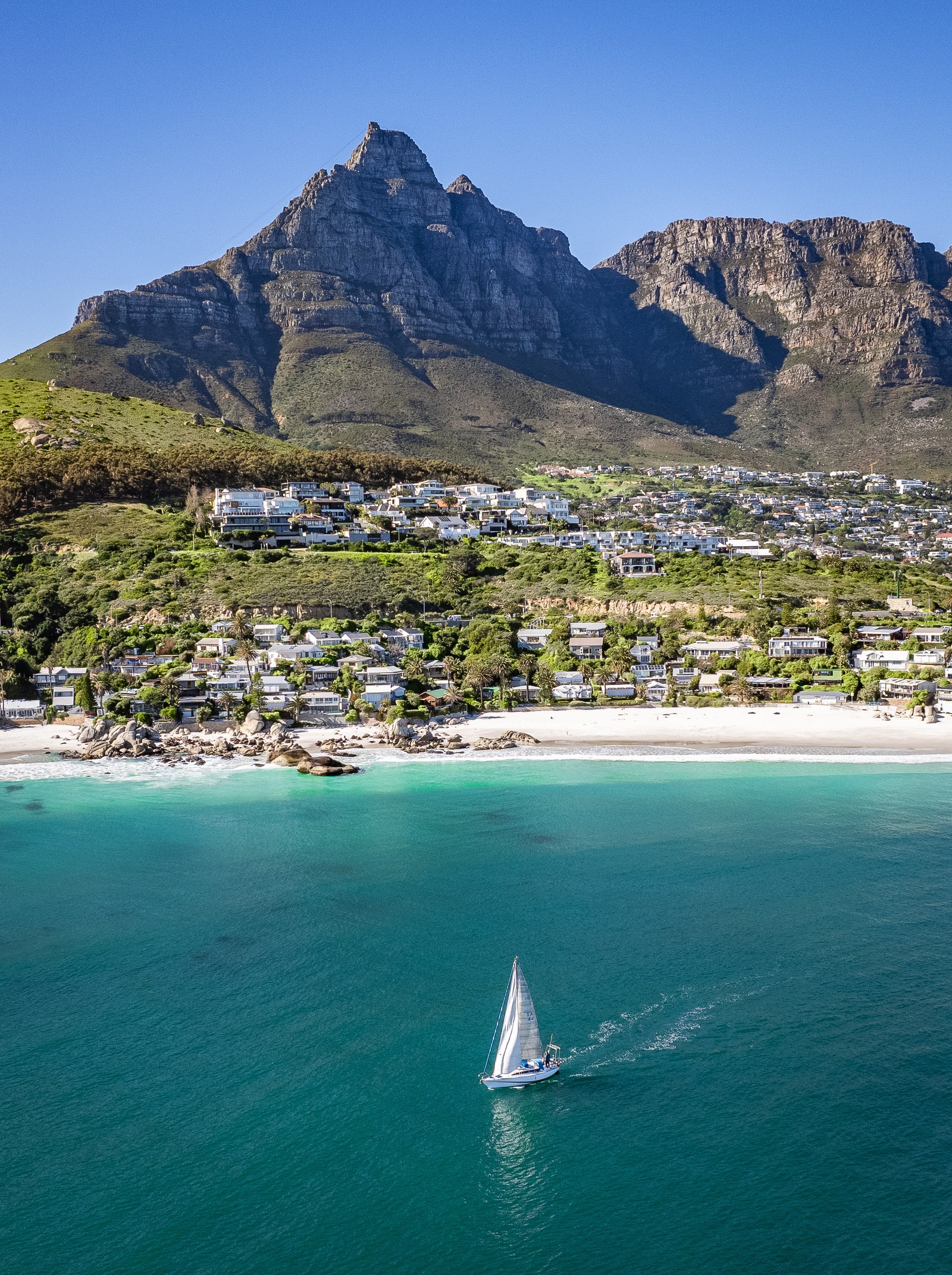 Scenic view of Cape Town, South Africa, including a boat and the coastline.