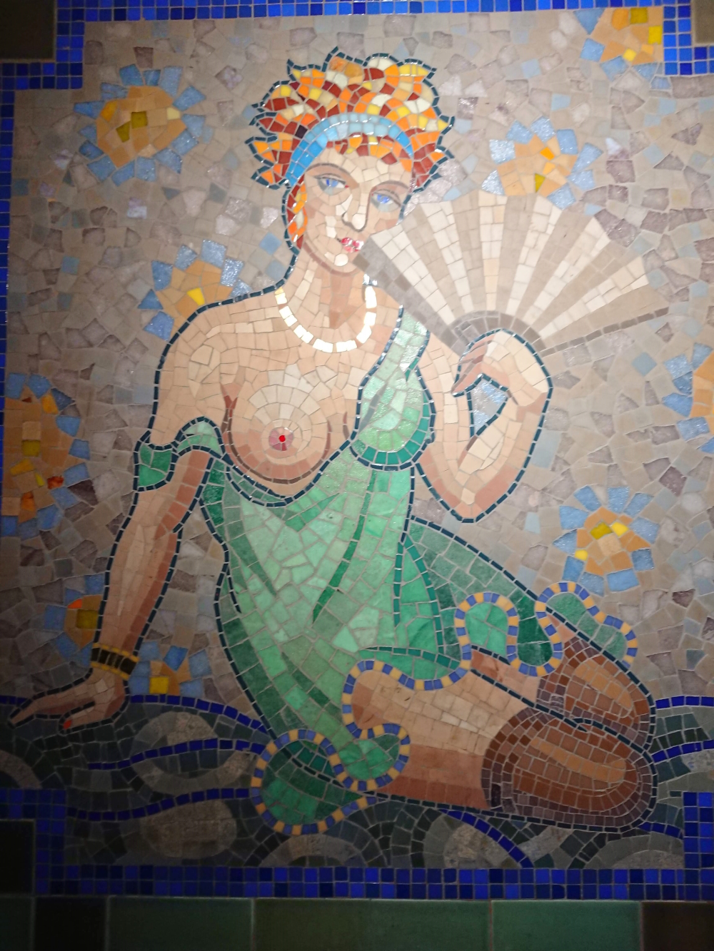 Mosaic in the entry at Aux Belles Poules