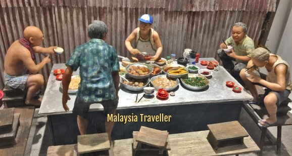 Model depicting people enjoying street food.