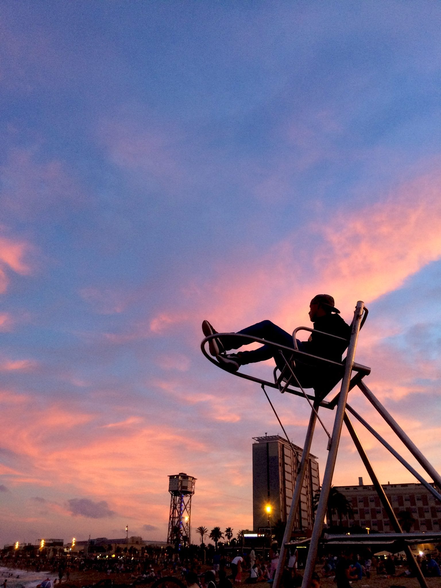 Lifeguard on duty at Barceloneta beach during sunset.