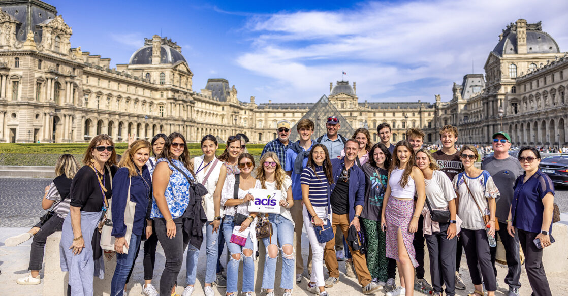 An ACIS group in front of the Louvre on a sunny day