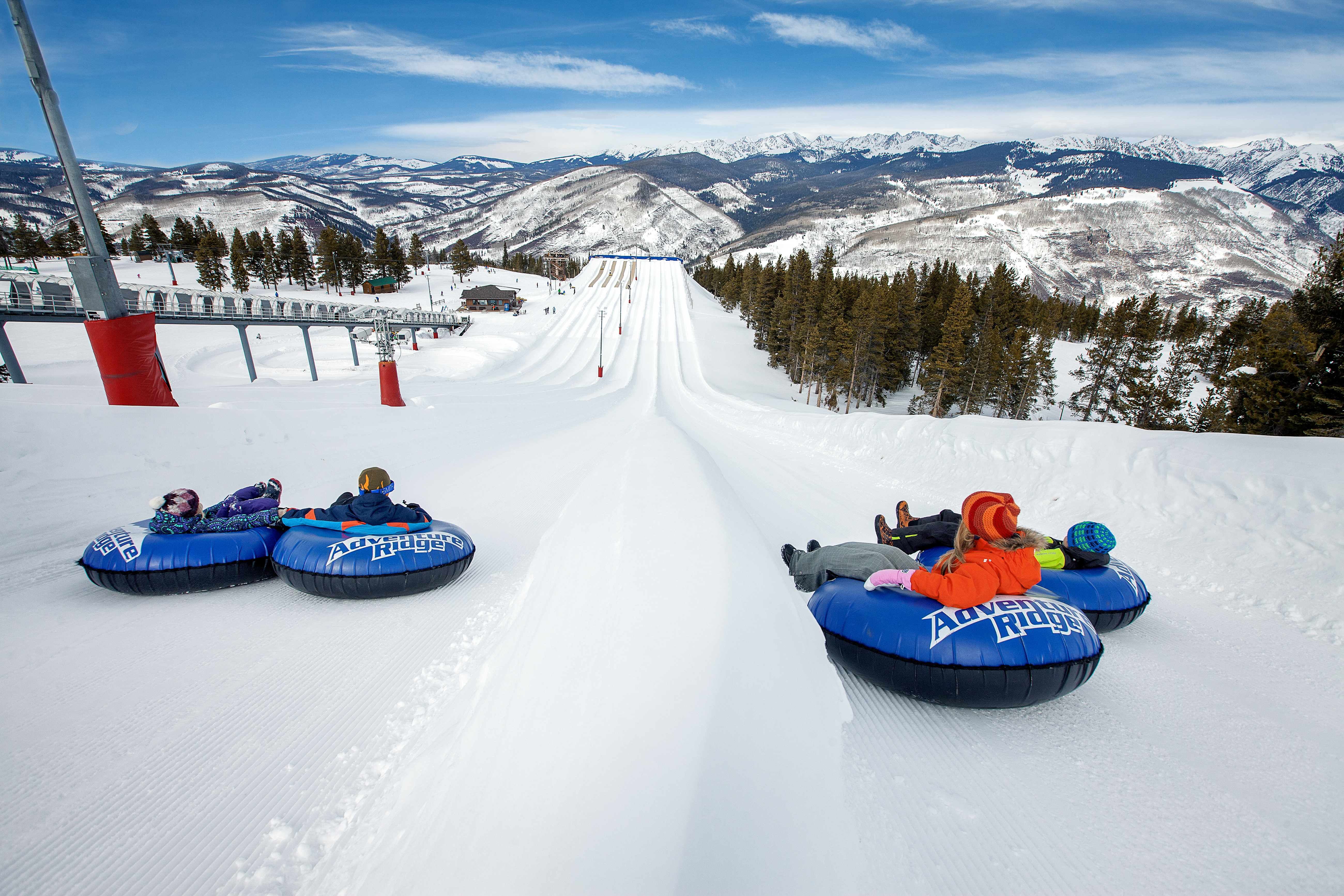 Snow tubing offers fun during ski trips and requires gear included on a ski packing list