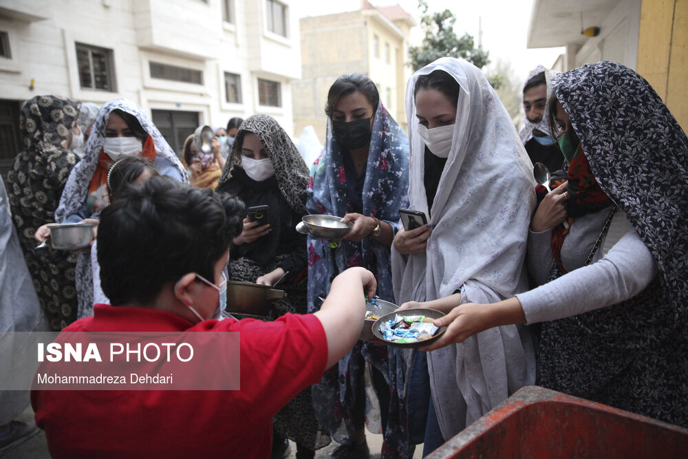 youth wear disguises for the spoon-banging tradition