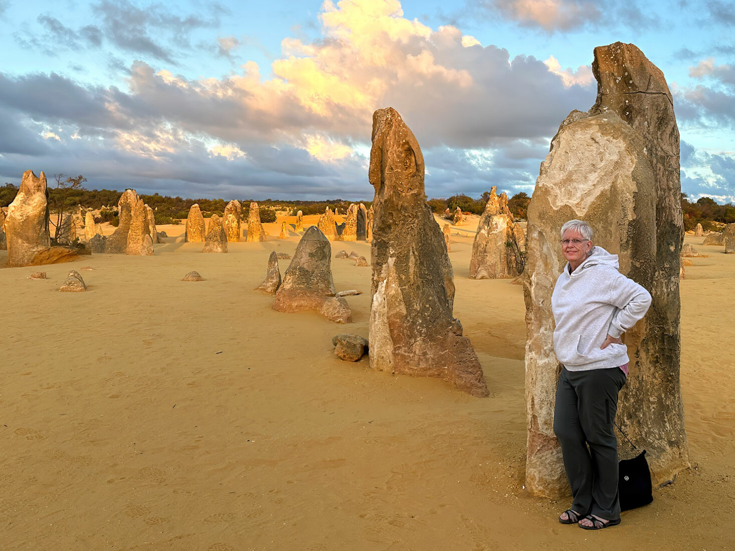 Standing next to one of the mysterious spires at The Pinnacles in Western Australia